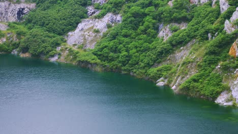 the old closed rock quarry a natural tourist attraction with a large blue pond is an interesting point in thailand