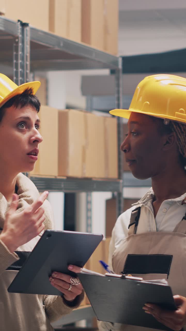 Vertical video: Multiethnic team of supervisors counting boxes of goods