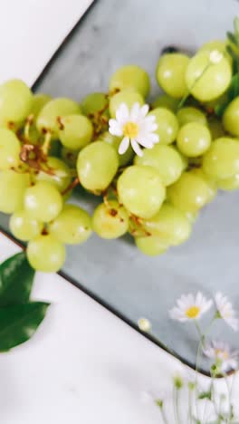 fresh green grapes and flowers arrangement