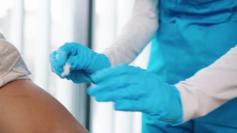 Close-Up-Shot-Of-Healthcare-Worker-Specialist-Hands-In-Protective-Gloves-Making-Vaccination-To-Patient,-Nurse-Hand-Injecting-Vaccine-Into-Patient-Arm-In-Hospital-Lab,-Vaccination,-Injection-Concept