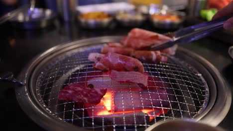 beef and bacon grilling on a barbecue