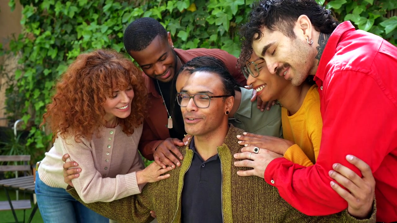 Diverse Group of Friends Supporting Each Other Outdoors