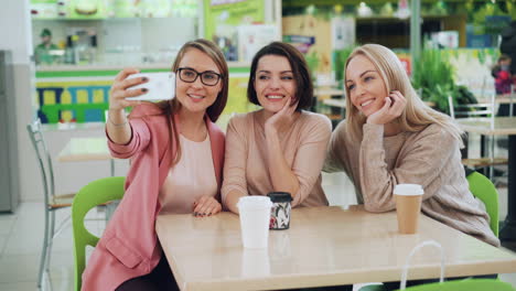 friends taking a selfie in a food court