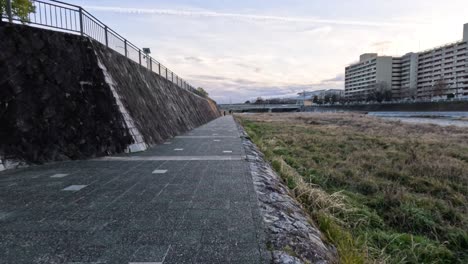 scenic walkway beside river and buildings