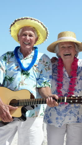 senior friends playing guitar