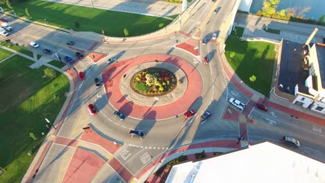 scenic aerial rotation of roundabout, traffic driving in circle