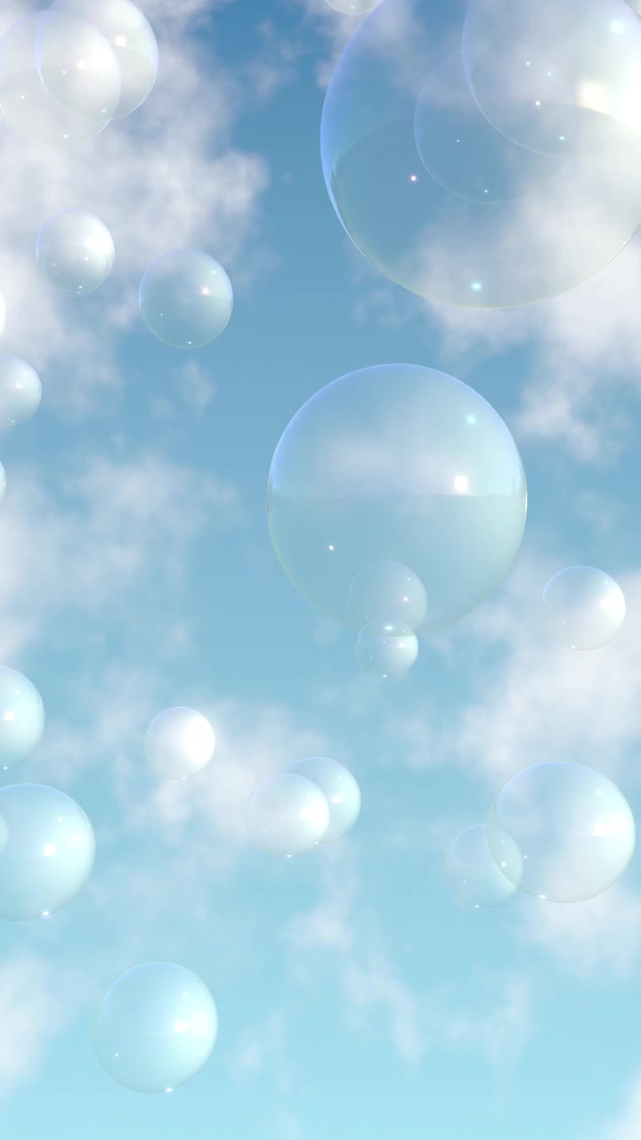 Iridescent bubbles drift slowly through a sunny sky with soft white clouds in vertical orientation