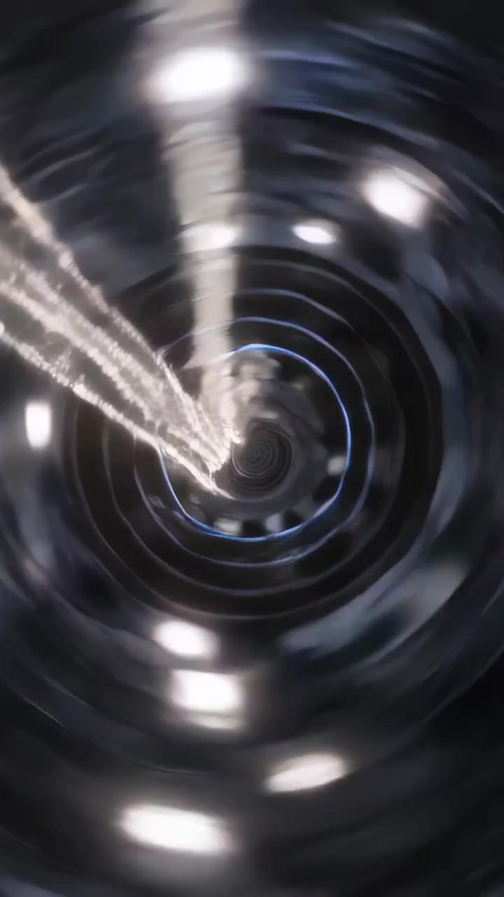 Vertical video: Entering left, jet pushing plume through tunnel pulsing rings, suggesting traversal