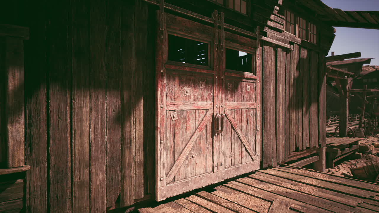 Old wooden barn doors in a sunny rural setting