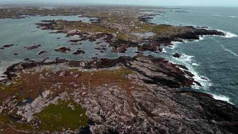 a rocky piece of irish coastline with pools and small bays