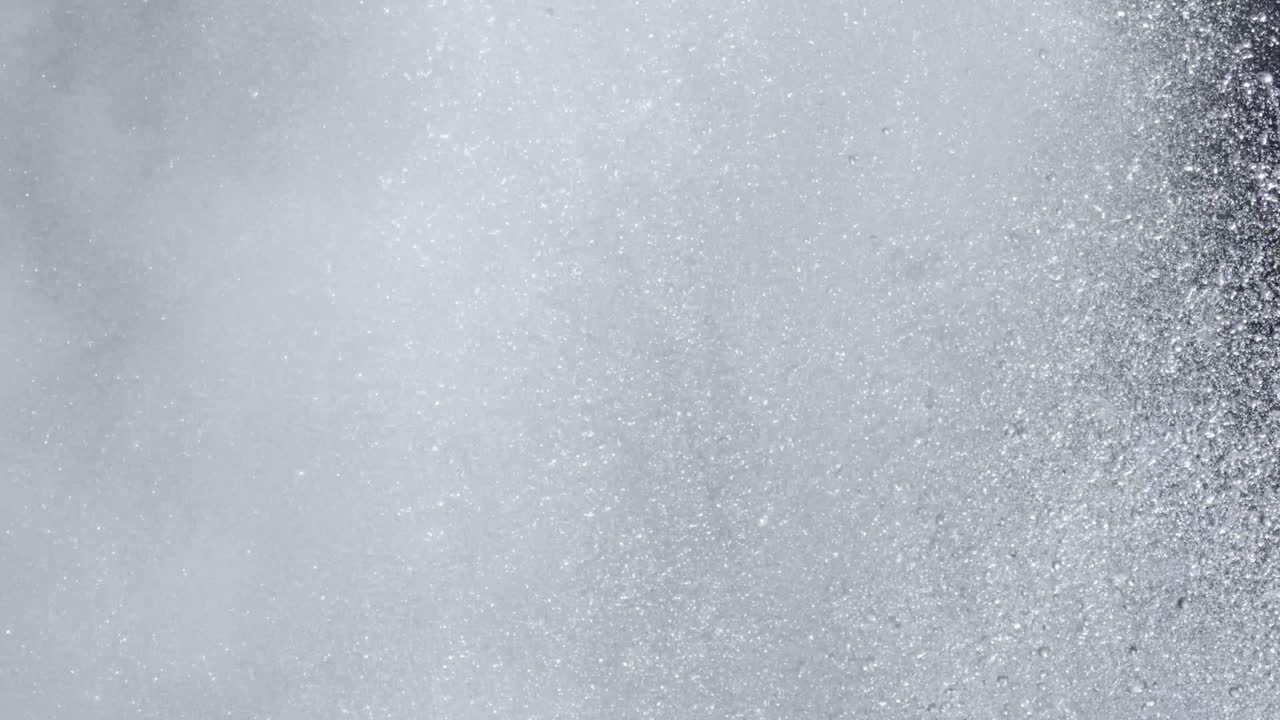 Slow motion close up of a geyser erupting in Yellowstone National Park