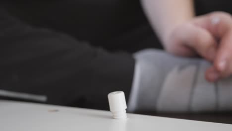 slow-motion-close-up-of-hammering-a-thick-white-screw-into-a-wardrobe-from-Ikea