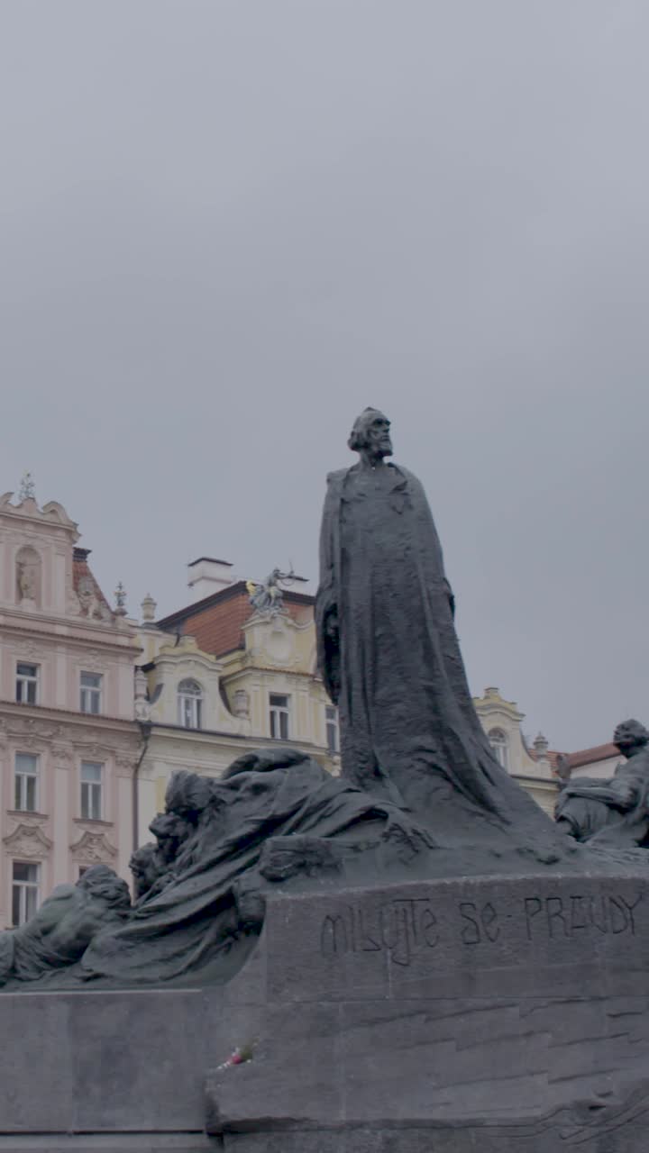 Prague architecture with historic statue on a cloudy day, vertical orientation