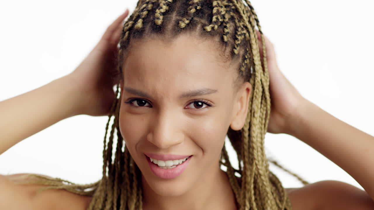 Woman with blonde braids expressing frustration