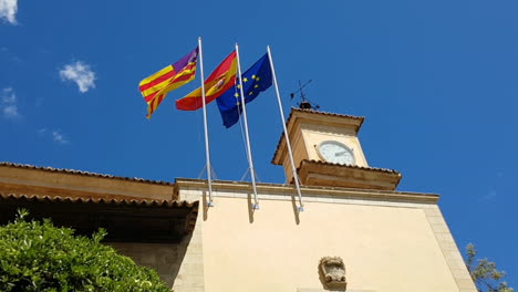 Flags-of-Europe,-Spain-and-the-Balearic-islands-waving-in-Palma-de-Majorca