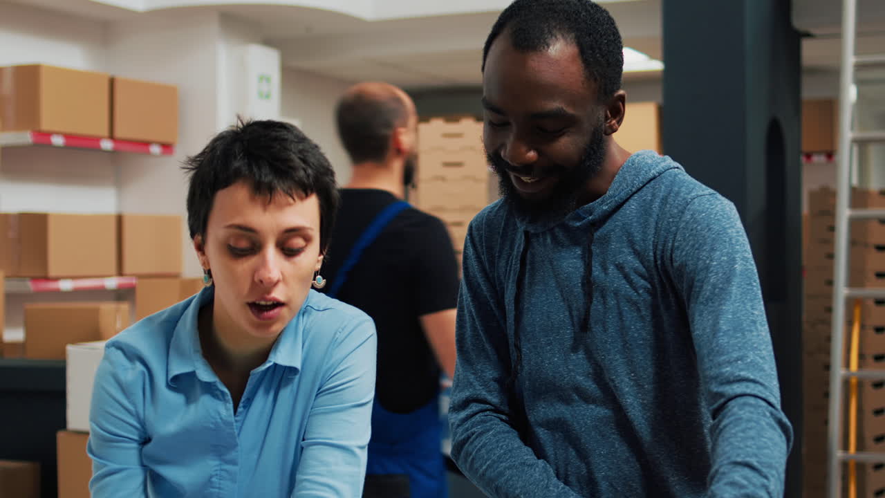 Warehouse Team Packing Boxes for Shipping