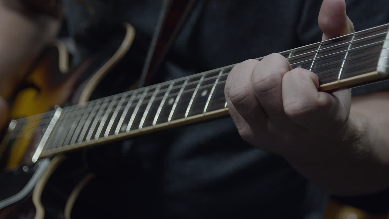 Guitar player close up in slow motion