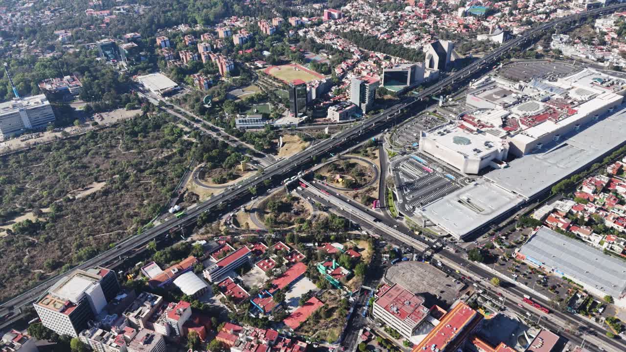 Slow-motion drone footage of a highway cloverleaf, CDMX
