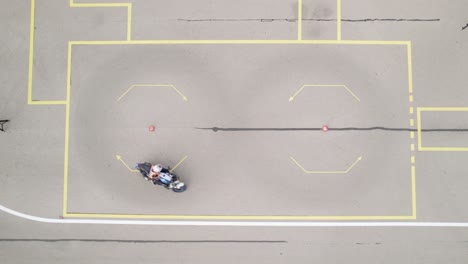 Bird-Eye-View-of-Motorcycle-Biker-Driving-Figure-of-Eight