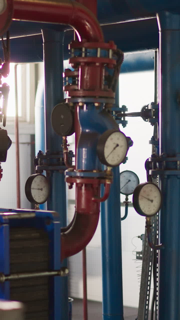 Complicated pipeline system and powerful pumps in boiler house. Heat producing equipment installed in modern building. Central heating utilities