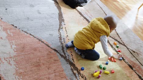 boy playing with building blocks in a comfortable home 4k