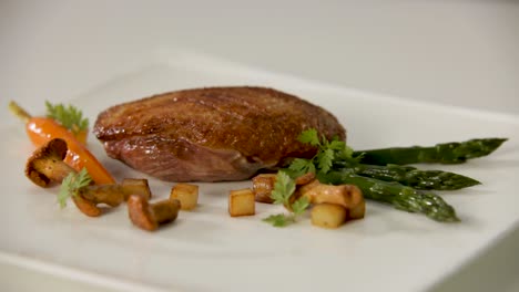 seared duck breast with asparagus and roasted vegetables