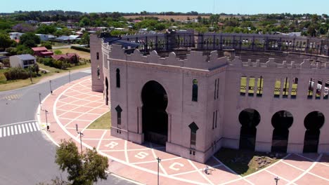 Aerial-orbit-of-the-front-of-the-bullring-in-Colonia-del-Sacramento,-Uruguay