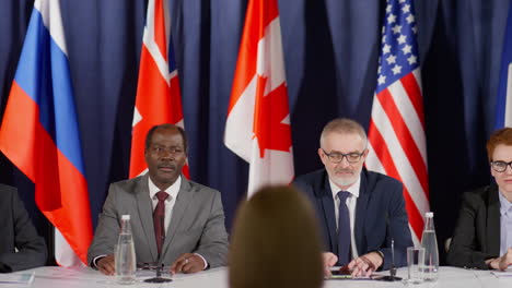 group of political leaders at press conference