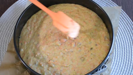 pouring delicious cake batter into tray