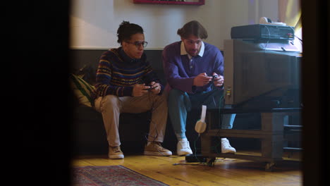 two men playing videogames