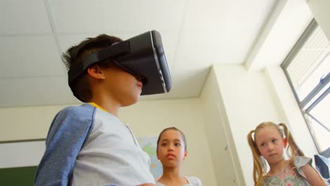 schoolboy using virtual reality headset in classroom at school 4k