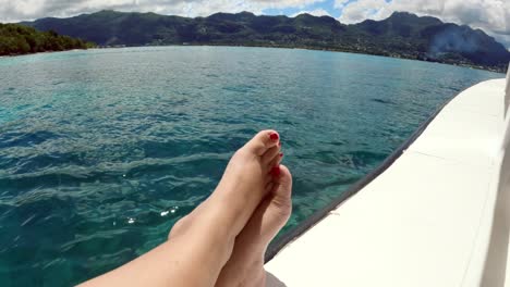 seychelles, st anne marine park client sitting on boat side while cruising