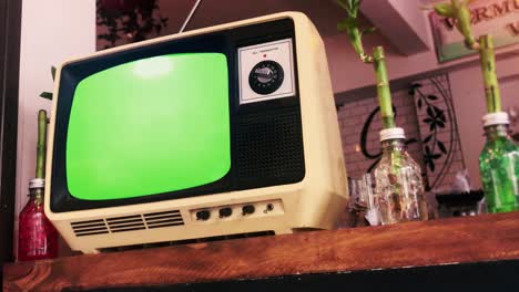 old television with green screen. close up. zoom in. 4k resolution.