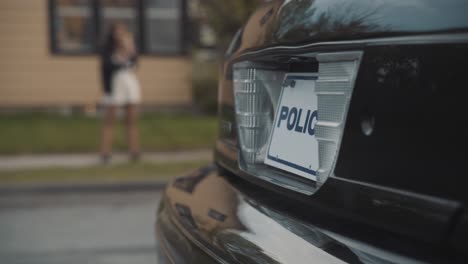 close up of police lights in the back of the car