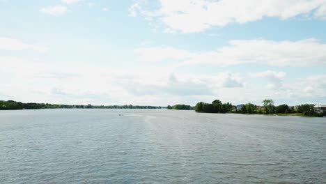 Drone-shot-of-speeding-boat-in-a-lake