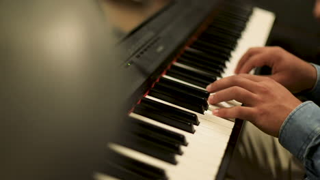a man playing the piano - close up- slow motion - low angle