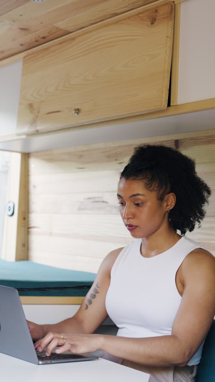 Woman Working on Laptop Inside a Van