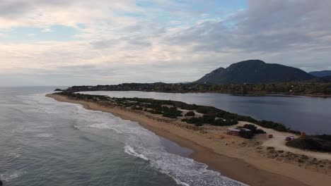 Perfect-aerial-drone-flight-panorama-over-view-drone-shot-of-mystic-sky-and-cloud-at-sunset-over-a
paradise-wild-nature-dream-beach-Corfu-Greece-autumn-2021