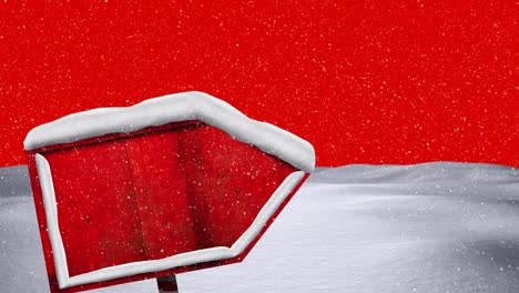 Animation-of-winter-scenery-with-wooden-sign-on-red-background