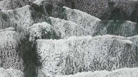 AERIAL---Multiple-waves-crash-on-beach