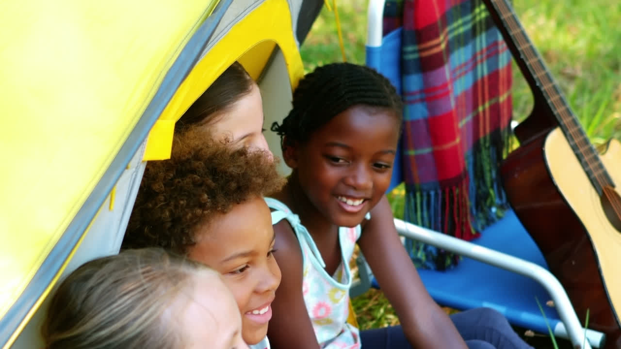 Kids having fun in tent on a sunny day
