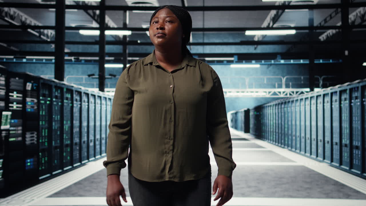 Supervisor in data center overseeing large scale IT equipment