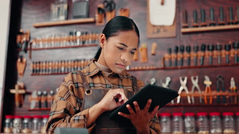 Leather-factory,-woman-in-with-tablet