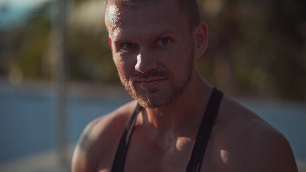 Sweaty Muscular Man Resting After Workout Outdoors