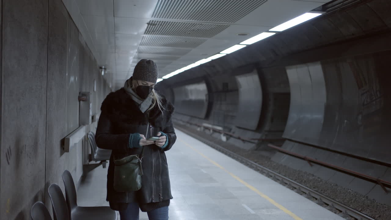 Woman Wearing Mask on Subway Platform