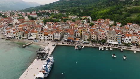 baska town and beach in the krk island, croatia- aerial drone shot