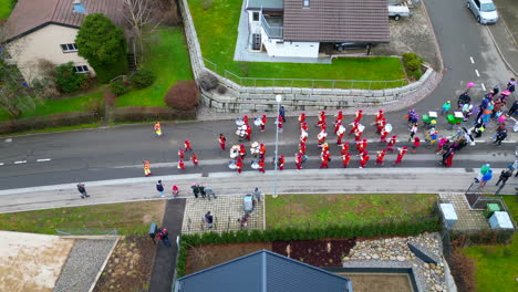 Aerial-of-Parade,-Children's-Carnival,-Bergdietikon,-Greater-Zurich-Area,-Switzerland