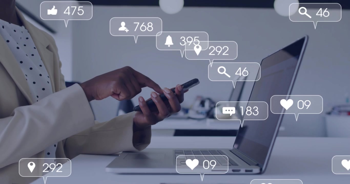 Digital marketer scrolling smartphone and tracking animated engagement icons floating around laptop