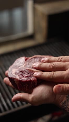 preparing a steak on a grill