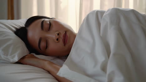 woman sleeping peacefully in bed
